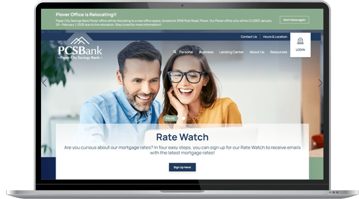 Paper City Savings Bank Website on Laptop Screen